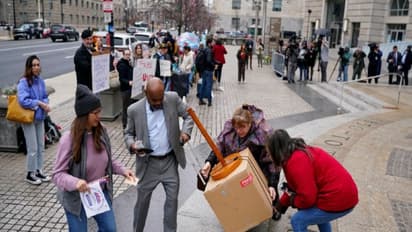 Laid-off USAID workers leave after they took their personal belongings from headquarters (Image Credit: Reuters) 