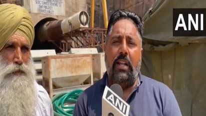 Family members of Gurpreet Singh, one of the eight workers trapped inside tunnel (Photo/ANI)