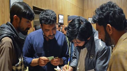 Passengers who were rescued from a train after it was attacked by separatist militants, get themselves registered at the Railway Station in Quetta, Balochistan (Image/Reuters)
