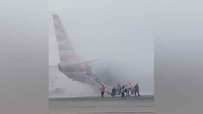 American Airlines flight catches fire in Denver, 12 injured in chaotic evacuation; WATCH viral videos