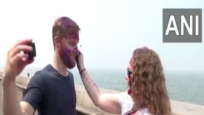 Foreign tourists celebrate Holi with locals in India (Photo: ANI)