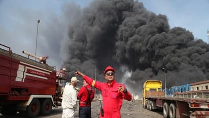 Firefighters work as smoke from explosion is seen at Shahid Rajaee port in Iran's Bandar Abbas (File photo/Reuters)