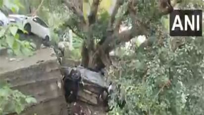 A car washed away after flash floods in Rampur. (Photo/ANI)