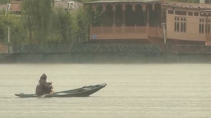 A view from Dal lake during heavy rain  (Photo/ANI)