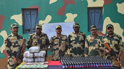 BSF South Bengal Frontier with the seized currency and contraband items. (Photo/ANI)