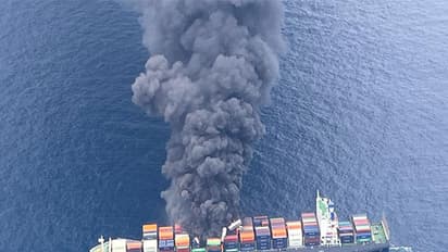 Image shows smoke rising following explosion onboard MV Wan Hai 503 (Image Credit: X/@IndiaCoastGuard)
