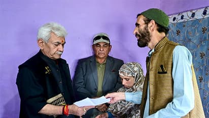 J&K LG Manoj Sinha hands job letter to his wife Gulnaz Akhter. (Photo/X/@OfficeOfLGJandK)