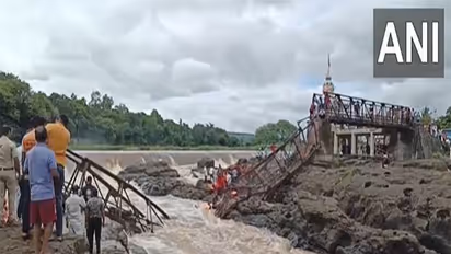 Rescue teams search for survivors amidst the debris of a collapsed bridge (Photo/ANI)