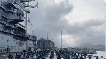 Navy personnel performing various yoga asanas on the deck of  INS Vikramaditya (Photo/ANI)