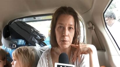 Russian woman Nina Kutina with her children after being rescued from a cave near Gokarna by police and processed by FRRO officials in Bengaluru (Photo/ANI)