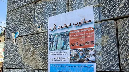 Posters put up to announce a Rs 20 lakh reward on information of terrorists involved in the Pahalgam terror attack, in Pulwama (Image/ANI)