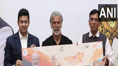 Milind Soman with BJP MP Tejasvi Surya, Union Minister Mansukh Mandaviya (Photo: ANI) 