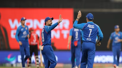 Rashid Khan and Mohammed Nabi celebrating (Photo: @ACBofficials X)
