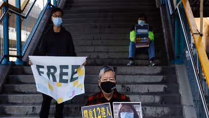 Pro-democracy supporters protest to urge for the release citizen journalist Zhang Zhan outside China's Liaison Office, in Hong Kong (Photo/Reuters)