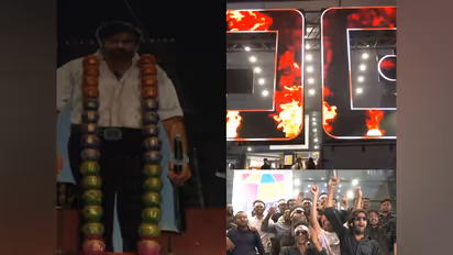 Pawan Kalyan cutout and fans outside theatres in Hyderabad (Photo: ANI)