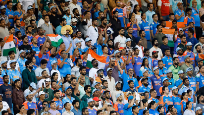 Spectators stand during the national anthem at Dubai International Cricket Stadium (Photo: ANI)