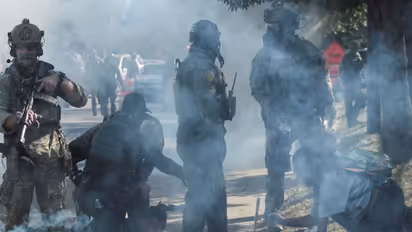 Tear gas rises during a standoff with ICE and federal officers in the Little Village neighborhood of Chicago, Illinois (Image/Reuters)