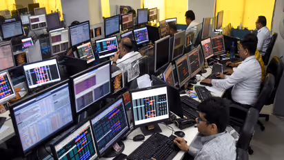 Shareholders and brokers monitor data during share trading (File Photo/ANI)