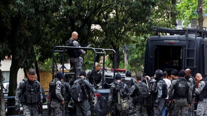 Members of the military police special unit gather to detain suspected drug dealers during a police operation against drug trafficking at the favela do Penha, in Rio de Janeiro, Brazil (Photo/Reuters)