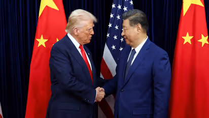US President Donald Trump meets with Chinese President Xi Jinping on the sidelines of the APEC summit, in Busan (File Photo/Reuters)