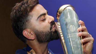 Virat Kohli kisses the ICC Men's Champions Trophy, 2025 trophy (Photo/ANI)