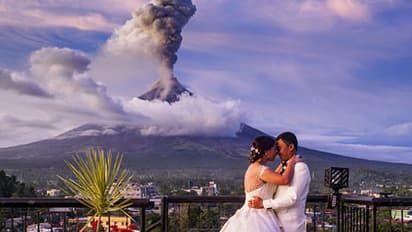 പുകഞ്ഞുകൊണ്ടിരിക്കുന്ന അഗ്നിപര്വ്വതത്തെ പശ്ചാത്തലമാക്കി അവര് വിവാഹിതരായി