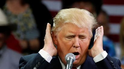 White House bans CNN reporter after verbal clash with Trump