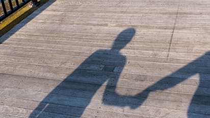 Hand holding unearth's 15-year long affair, four children!