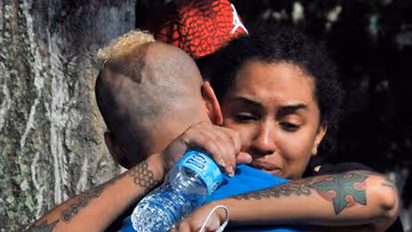 Orlando grieves its dead, stands defiant in tragedy