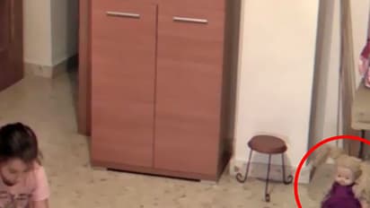 Watch: Lone doll moves its head on its own as child plays with another toy