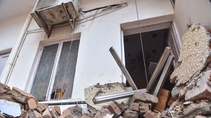 A view of the debris accumulated outside a house after a building collapsed near Satya Niketan at South-West Delhi (Photo/ANI)