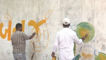Wall writing in Gujrati language in support of TMC candidate Mamata Banerjee (Photo/ANI)