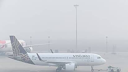 An aircraft waits to take off at the runway as dense smog reduce visibility and engulfs IGI airport. (Photo/ANI)