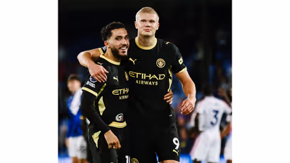 Rayan Cherki (L) and Erling Haaland celebrating (Photo: X/@ManCity)