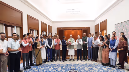 PMO officers with PM Modi (Photo/x/@PMOIndia)