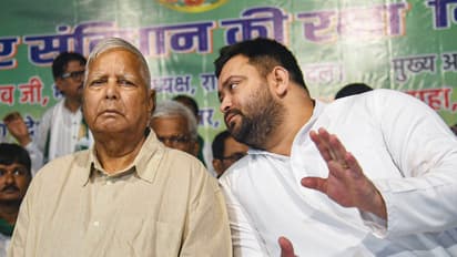 Lalu Prasad Yadav with Tejashwi Yadav (File Photo/ANI)