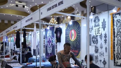 Tattoo artists at work during the International Nepal Tattoo Convention in Lalitpur, showcasing intricate designs and global styles. (Photo/ANI)