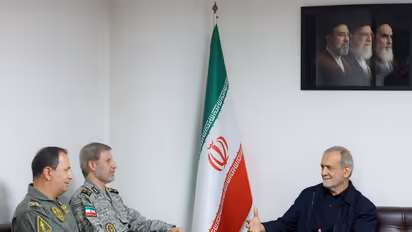 Iranian President Masoud Pezeshkian meets Iranian Army Commander-in-Chief Major General Amir Hatami during a high-level security meeting focused on military readiness and national defence. (Image Source: Iranian state media)
