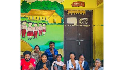 People show their ink-marked fingers after they cast vote for the Kerala assembly election (Photo/ANI)