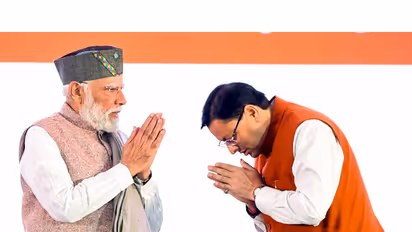PM Narendra Modi with Uttarakhand CM Pushkar Singh Dhami (Photo/ANI)