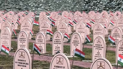 Rows of memorial headstones adorned with the National Flag at the war memorial (Photo: ANI)