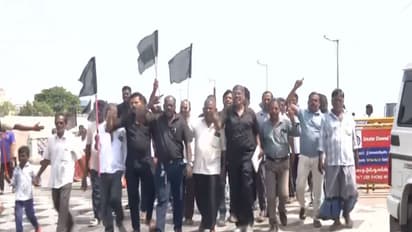 Fishermen raise black flags during protest in Chennai's Pattinapakkam (Photo/ANI)