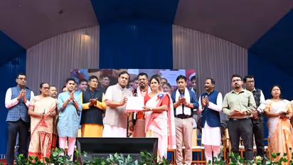 Assam Chief Minister Himanta Biswa Sarma presents cheques to beneficaries (Photo/ANI)