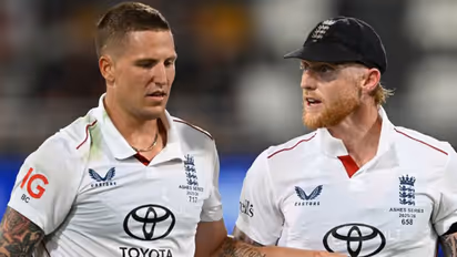 Brydon Carse (L) and Ben Stokes (R). (Photo: England Cricket)