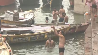 Devotees brave the cold wave to take a holy dip in the Ganga River in Dashashwamedh Ghat, Varanasi (Photo/ANI)