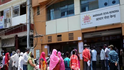 People queue outside an Aadhaar service centre (Photo/ANI)