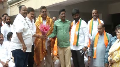 Telangana BJP State President N Ramchander Rao with the residents of Madhu Park Ridge Apartments (Photo/ANI)