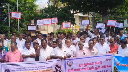 Lorry owners and drivers protest infront of PwD office in Tiruchirappalli (Photo/ANI)