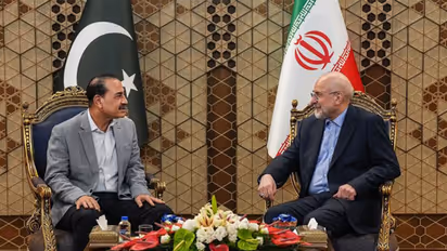 Iran Parliament Speaker Mohammad Bagher Ghalibaf (R) meets with Pakistan Army Chief General Asim Munir (L) in Tehran (Image Source: Iranian state media)