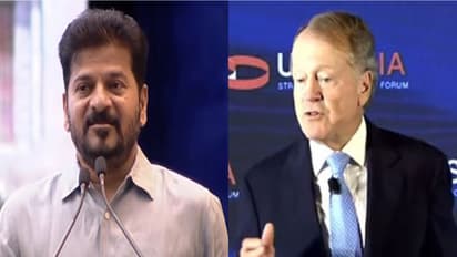 Telangana CM Revanth Reddy and John Chambers. (Photo/ANI)
